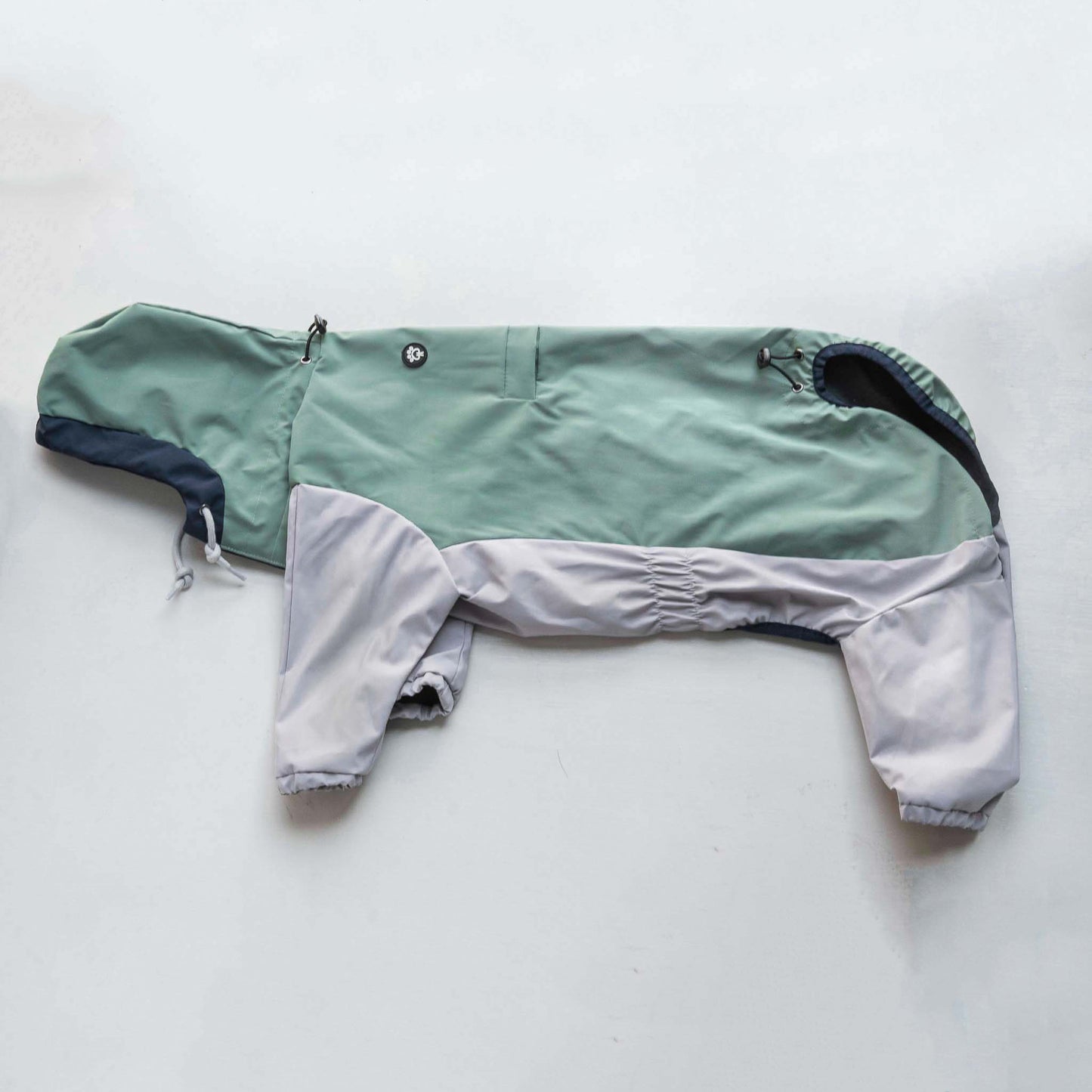 Side view of dog  raincoat, highlighting fit, coverage, and waterproof outdoor protection.